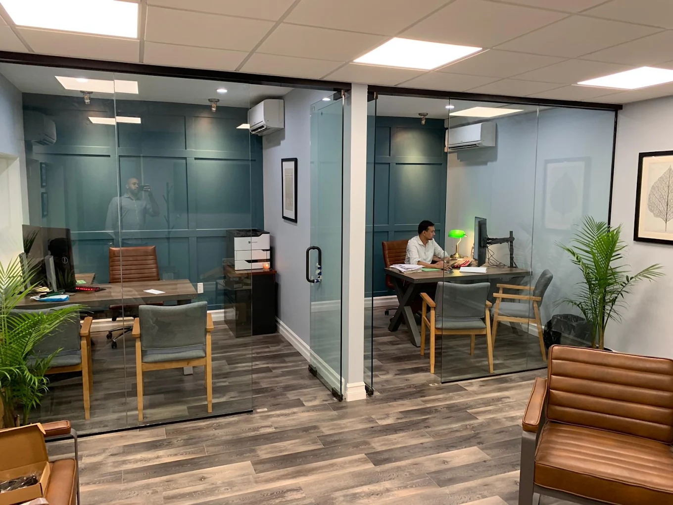 Dynamic Tax & Accounting Services office interior with glass-walled offices and modern workspace on Starling Avenue, Bronx